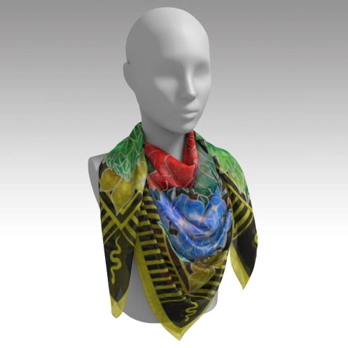 Mannequin wearing a colorful scarf with intricate patterns on a plain background