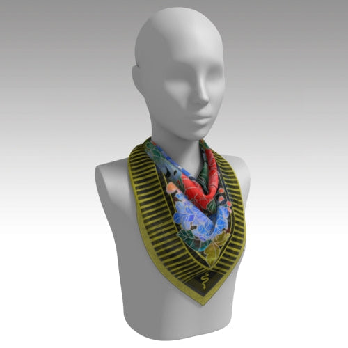 Mannequin wearing a colorful embroidered scarf on a plain background