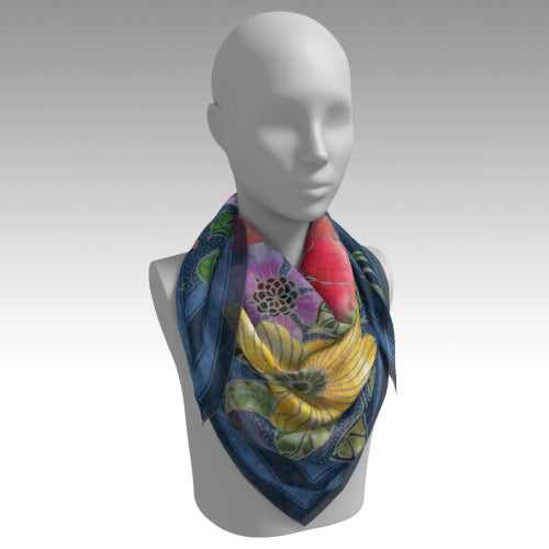 Mannequin wearing a colorful scarf with floral design on a gray background