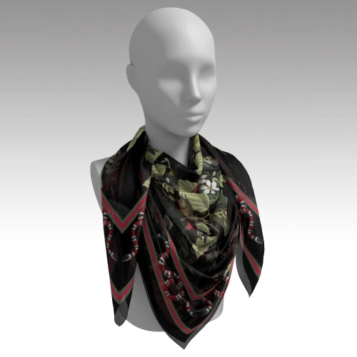 Mannequin wearing a patterned scarf on a plain background