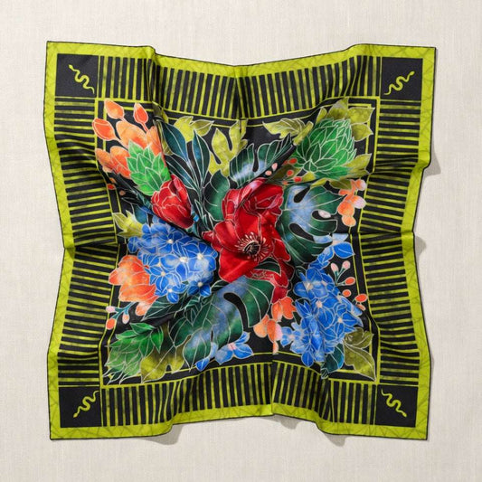 Colorful floral design on a black and green border against a beige background