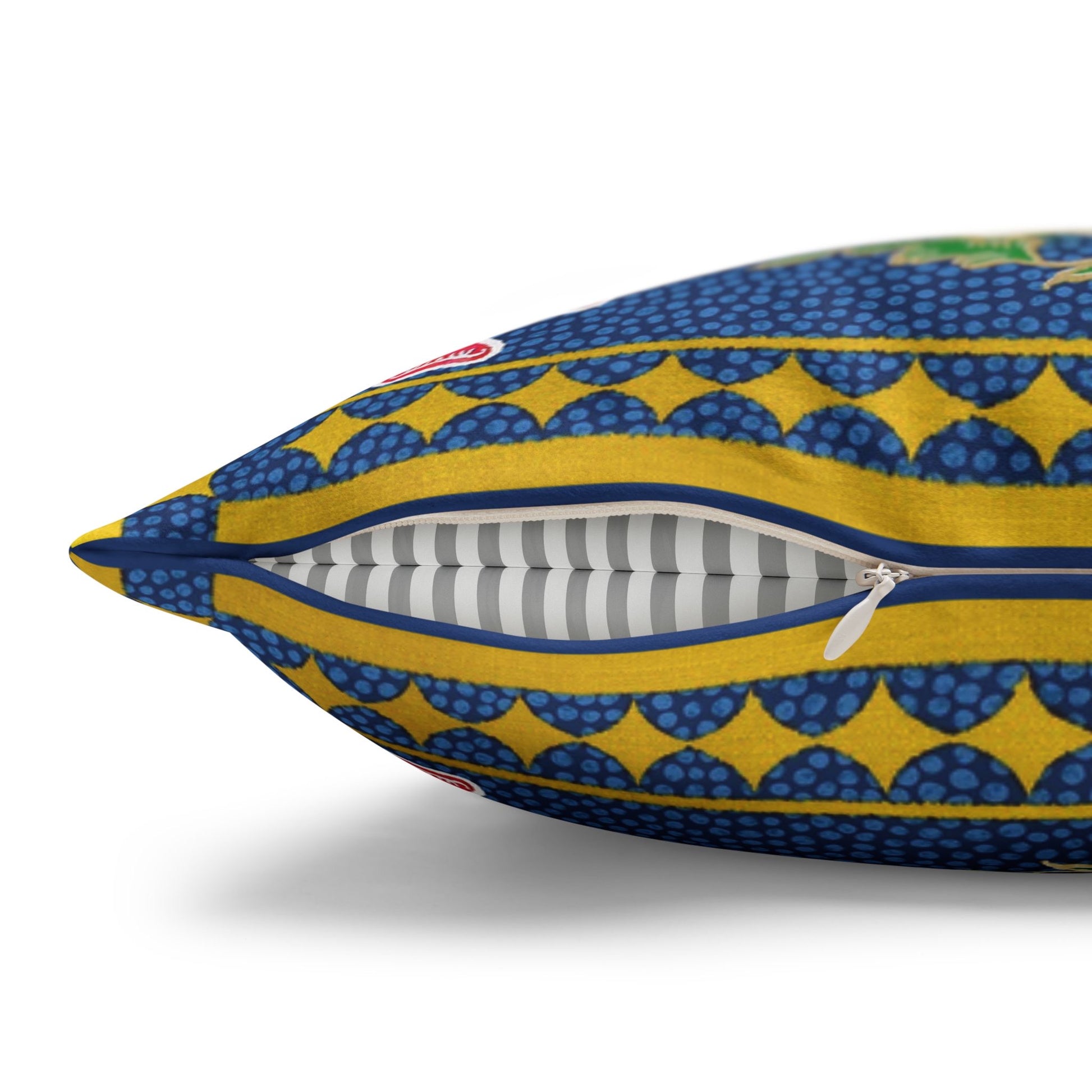 Decorative pillow with blue and yellow pattern on a white background