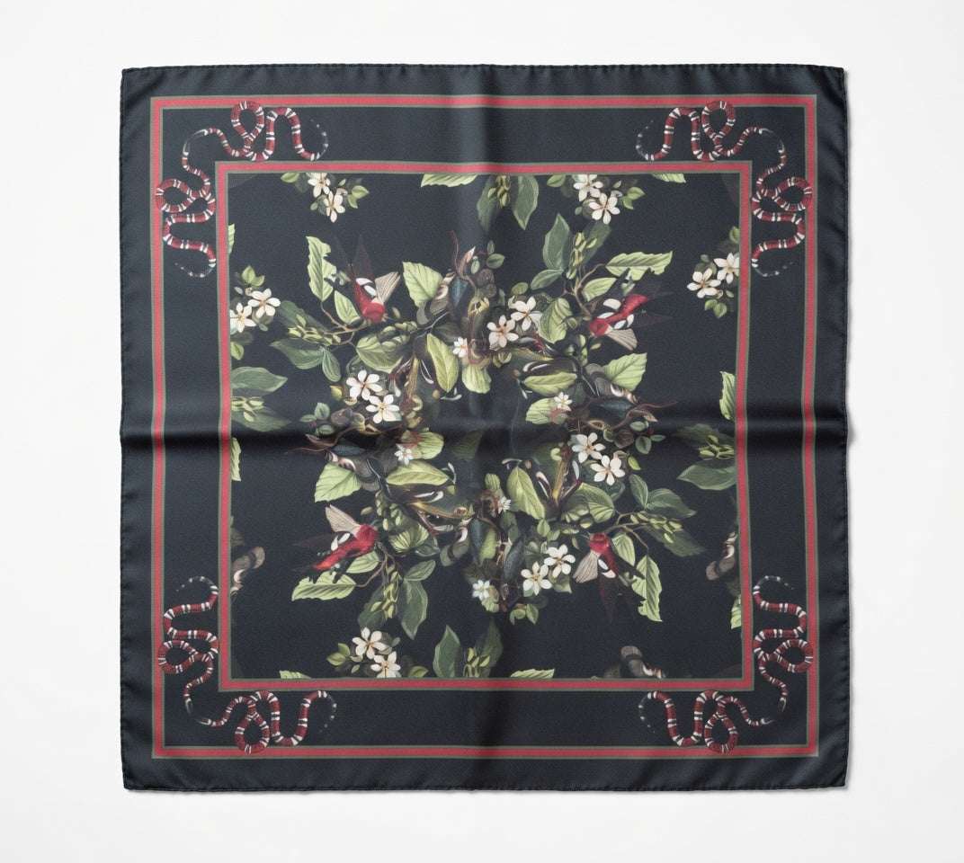 Floral patterned scarf with red border on a black background