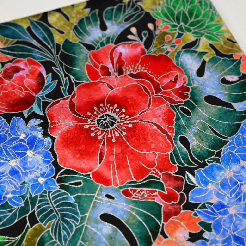 Colorful floral design with red, blue, and green flowers on a black background