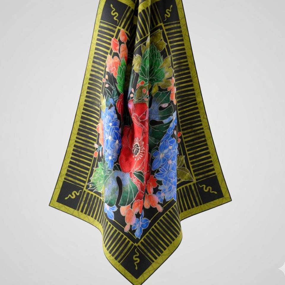 Decorative scarf with floral and geometric patterns on a white background
