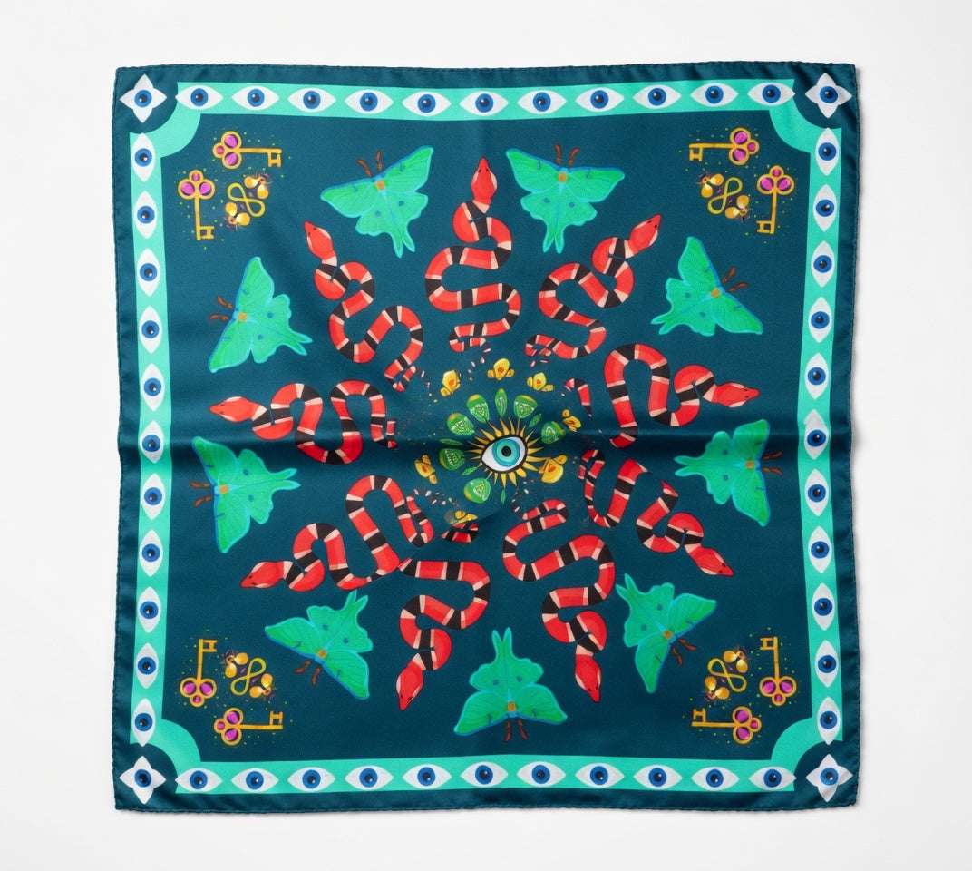 Colorful scarf with snake and butterfly design on a blue background