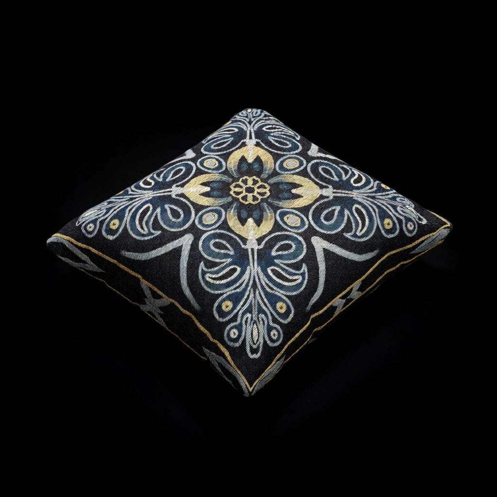 Decorative pillow with intricate pattern on a black background