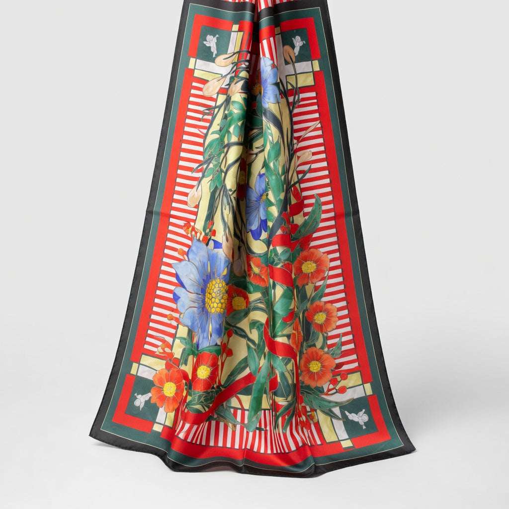 Colorful floral scarf with a red border on a white background